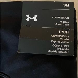 Under Armour black compression mid-rise speed capri. Small. With tags